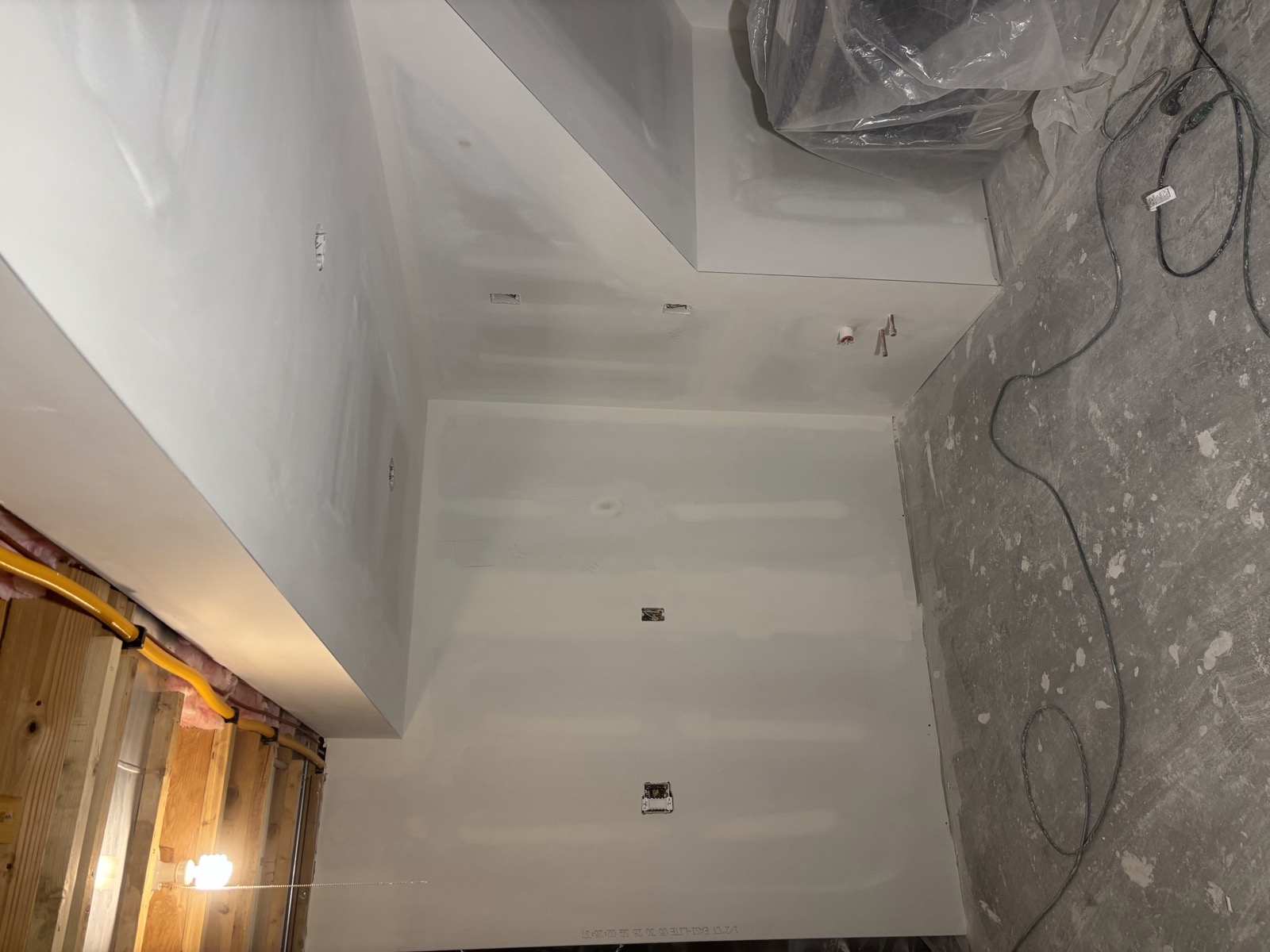 After: basement drywall mudded, corners finished, ready for paint