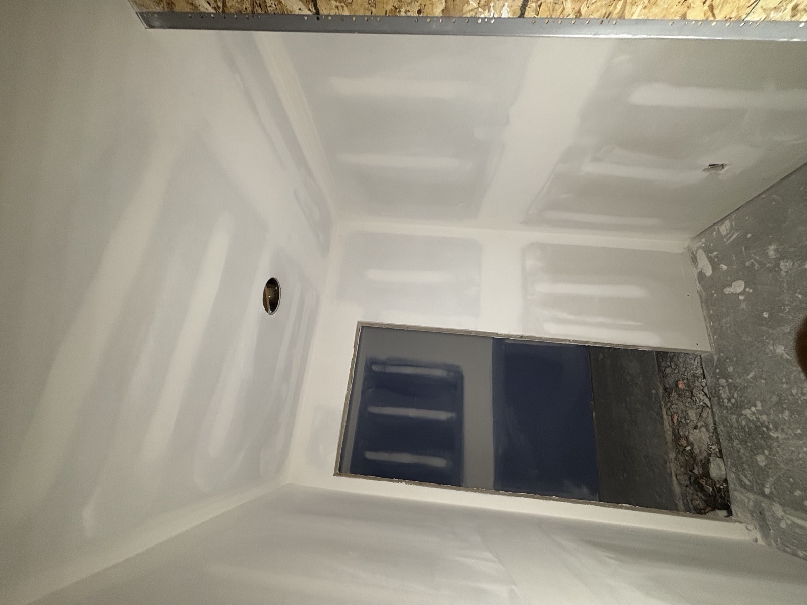 Finished basement room, drywall taped, mudded and smooth