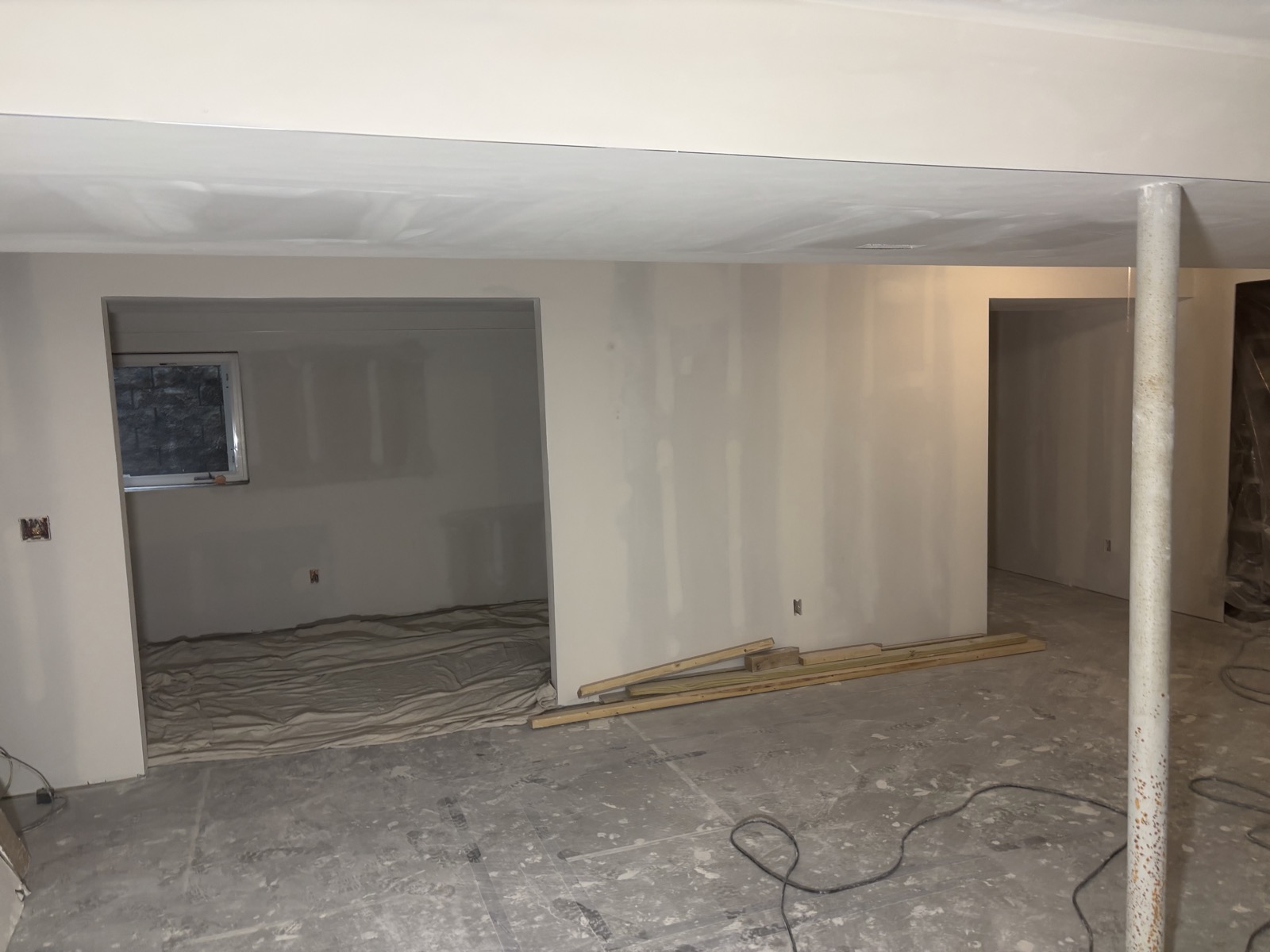 Finished basement room, drywall taped, mudded and smooth