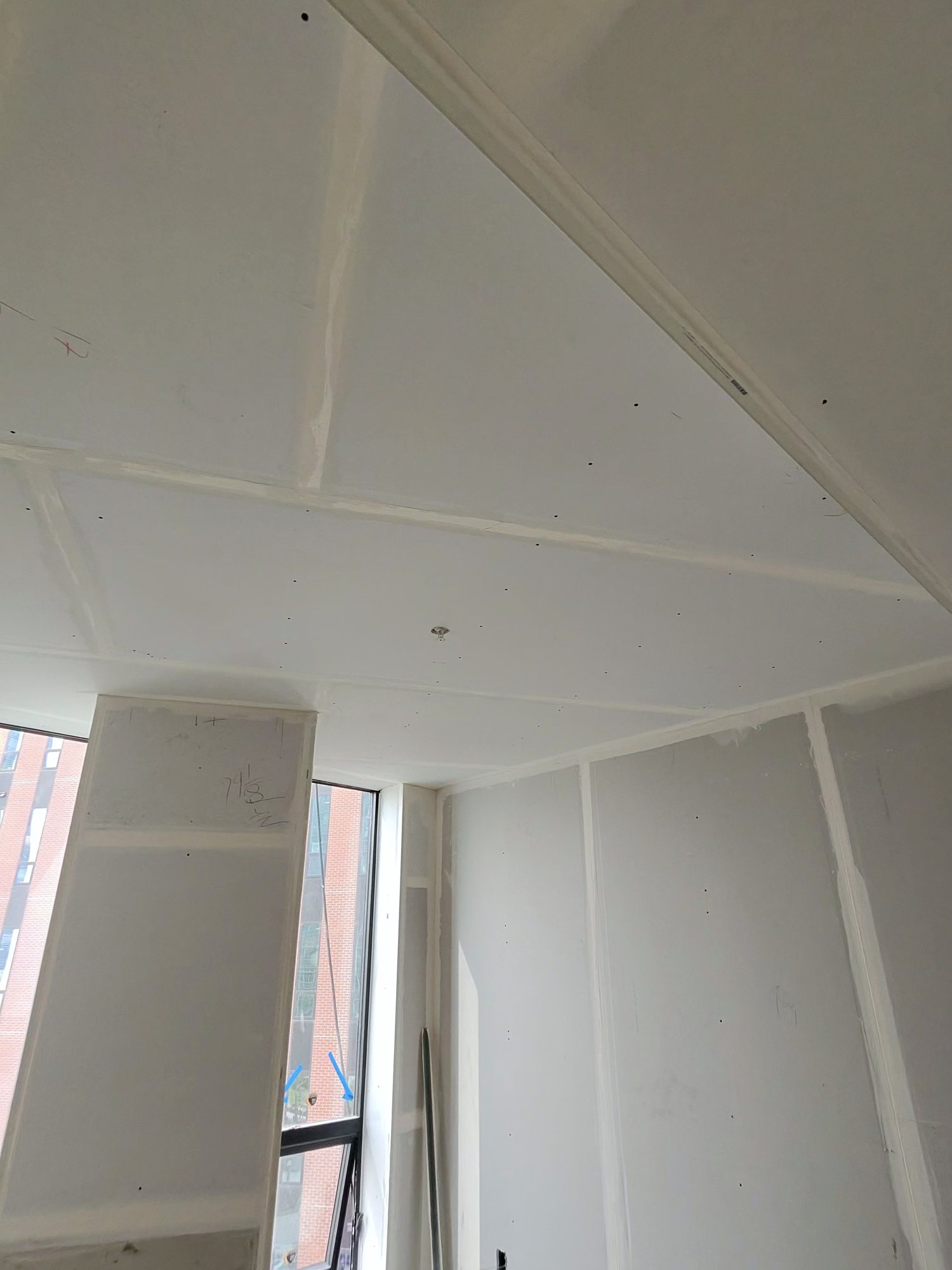 Angled ceiling and column, taped and sanded drywall