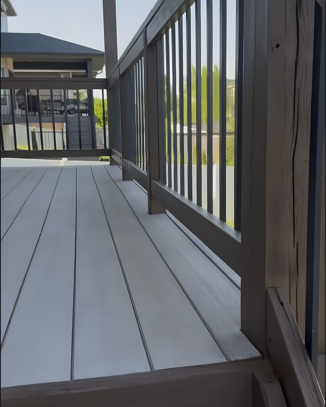 Deck staircase with railing, newly stained