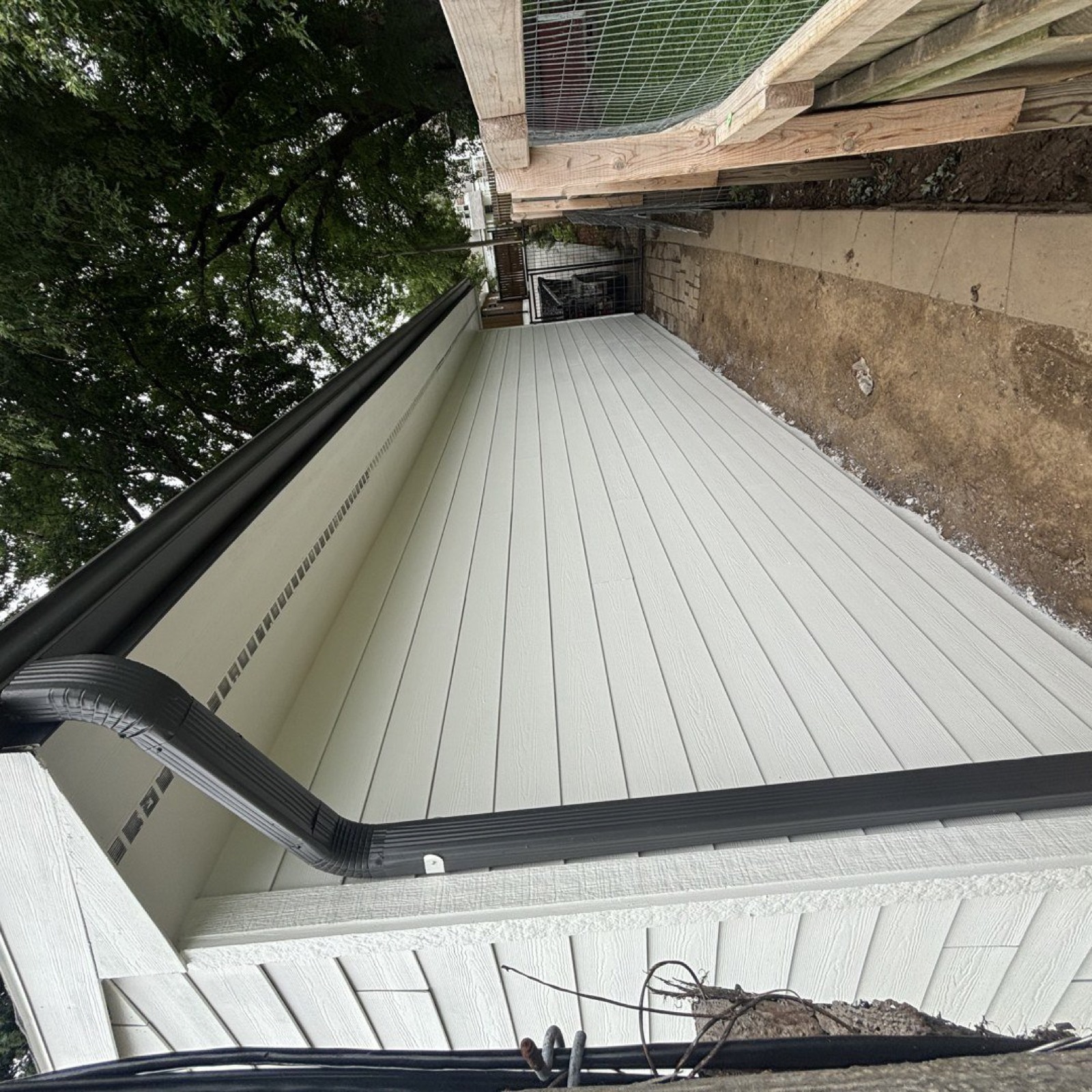Large white garage with new exterior paint, Bellevue